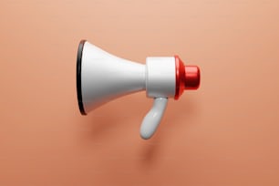 a white and red megaphone on a pink background