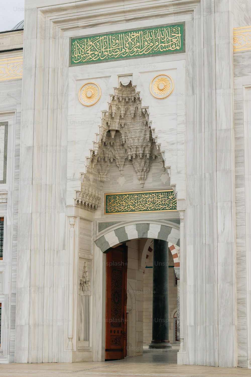 a large white building with a clock on it's side