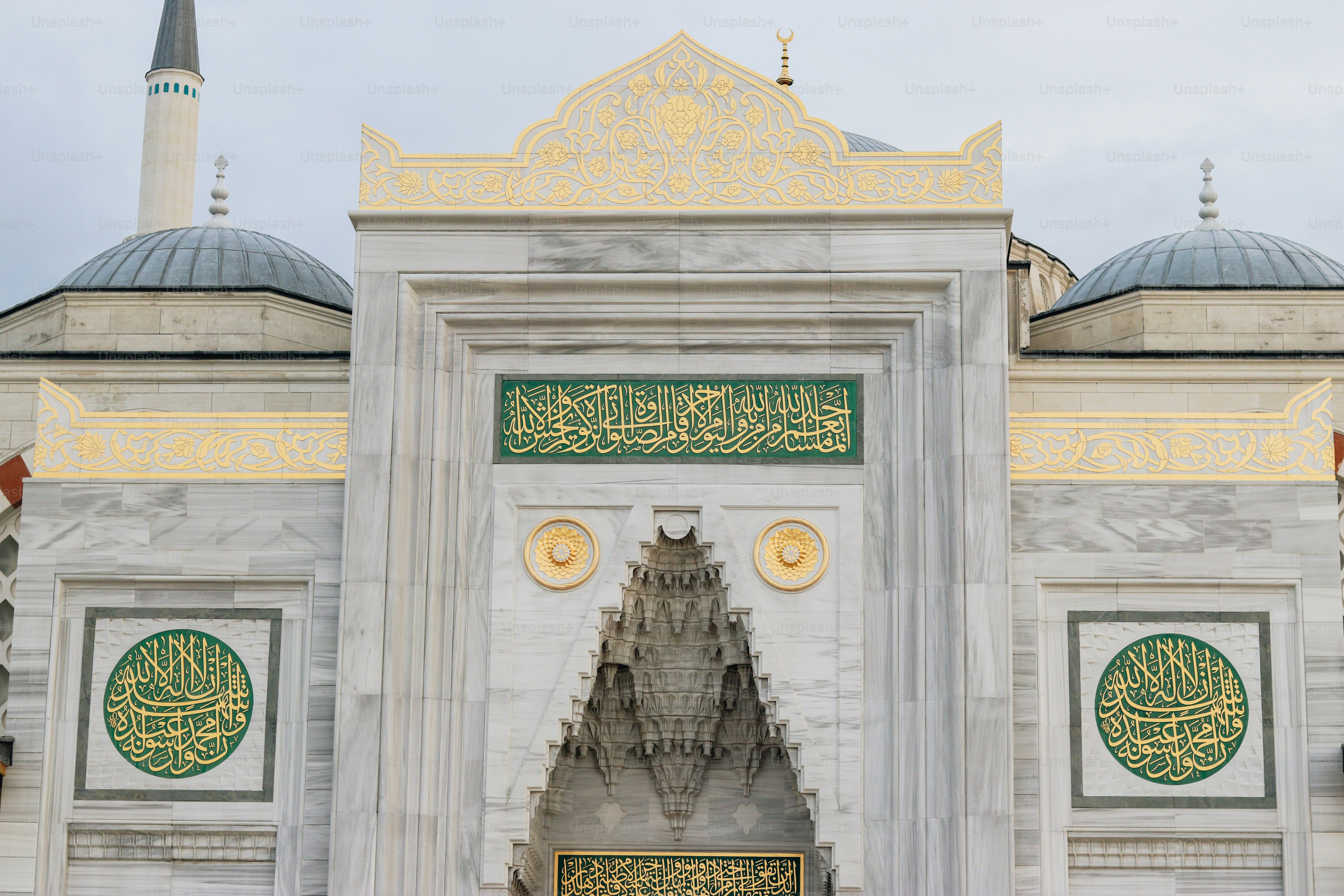 a large white building with a clock on the front of it