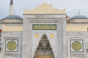 a large white building with a clock on the front of it