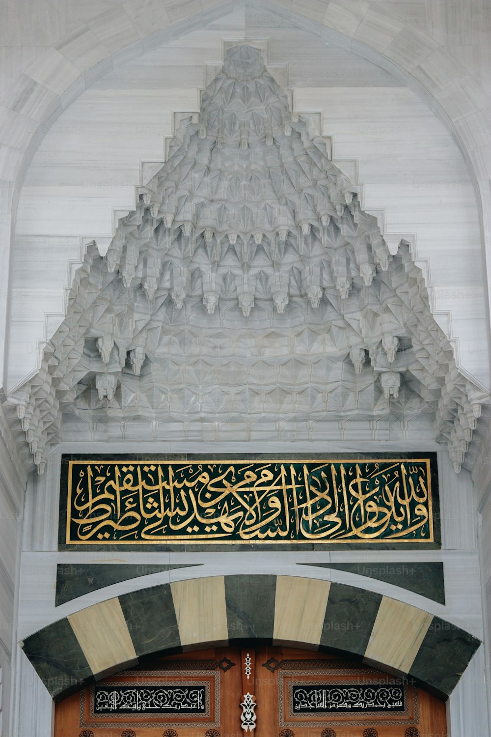 a large door with a decorative design above it