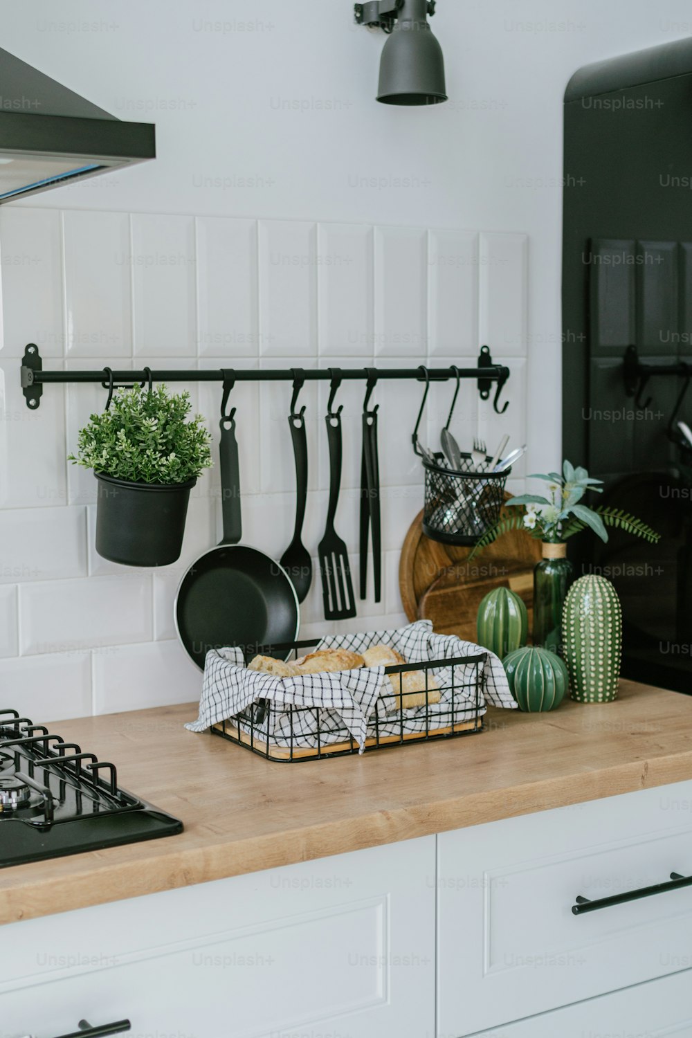 a kitchen counter with pots and pans on it