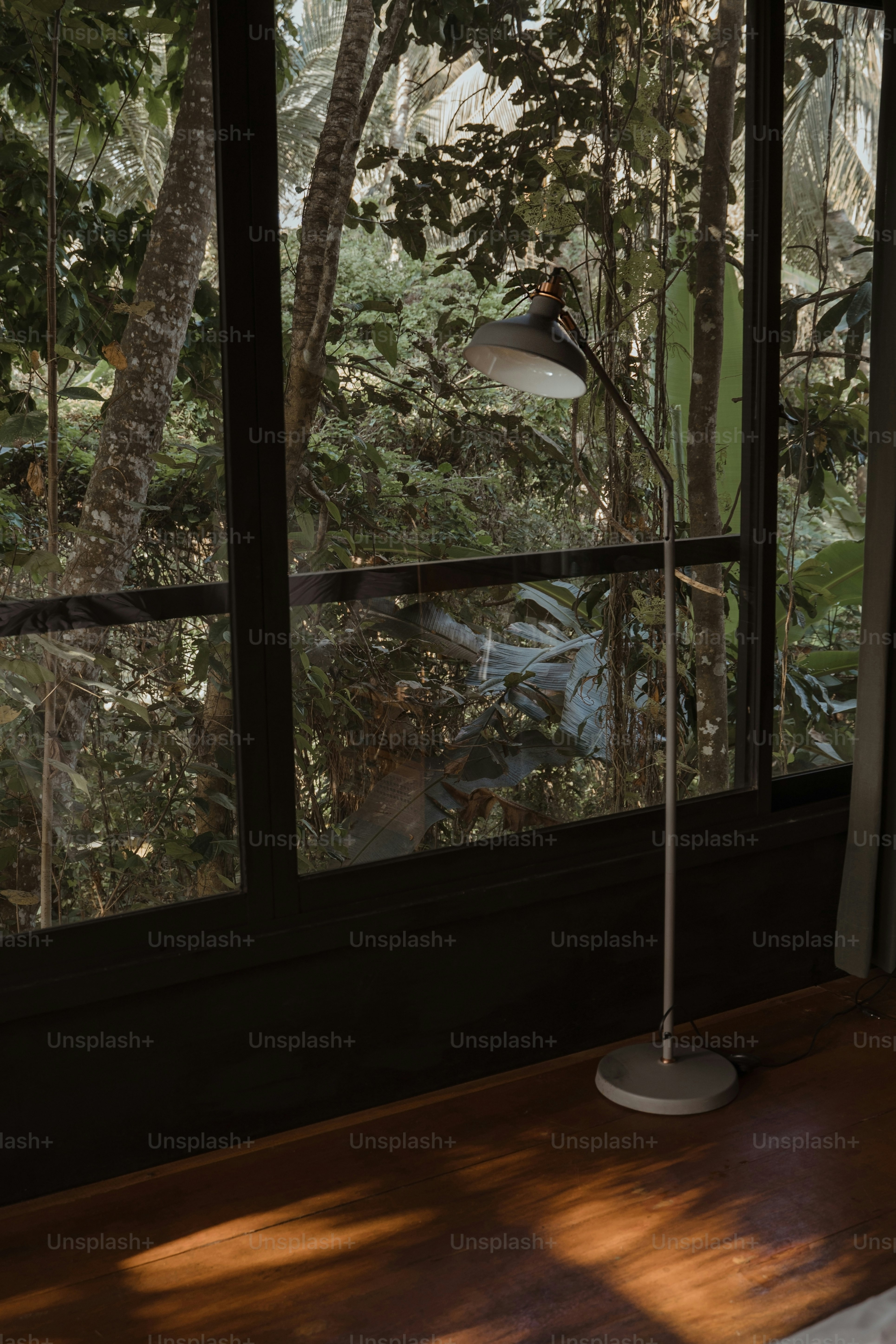 a floor lamp sitting on top of a wooden table