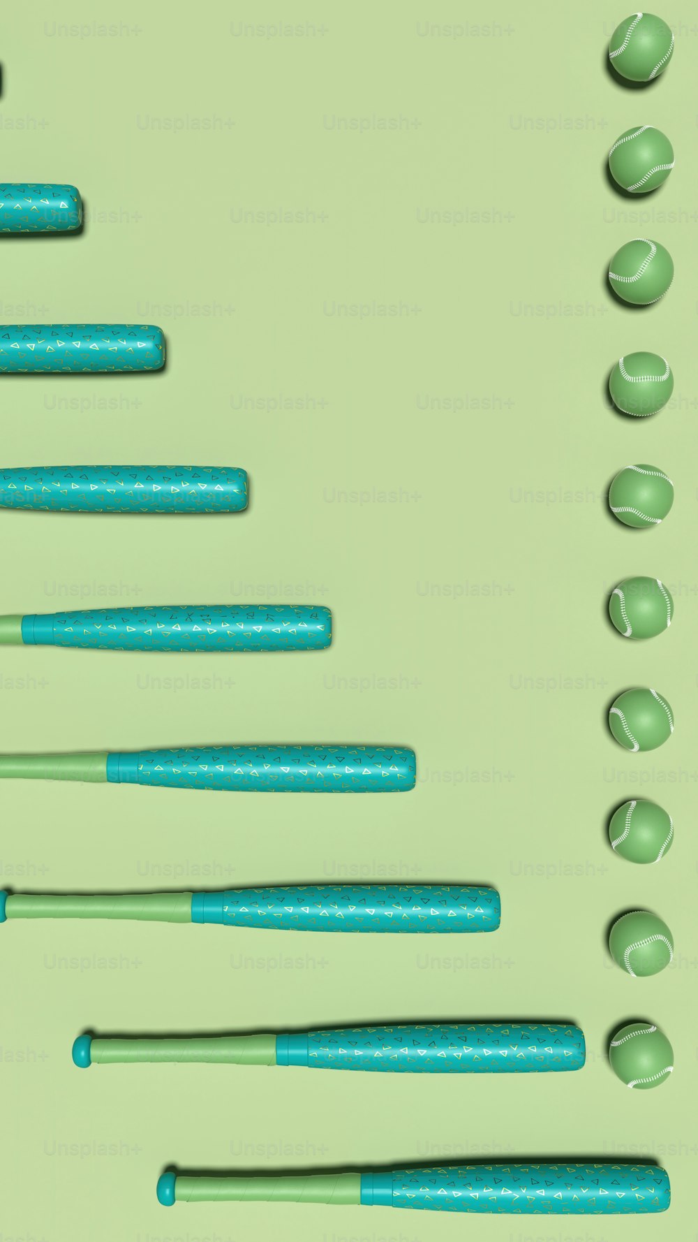 a group of blue and green pens sitting on top of a green surface