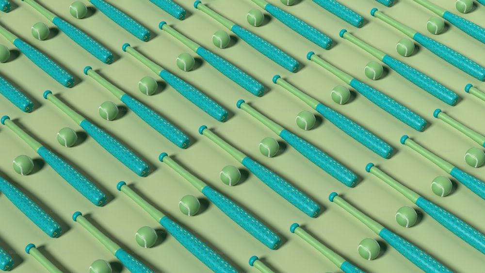 a row of green toothbrushes lined up on a wall