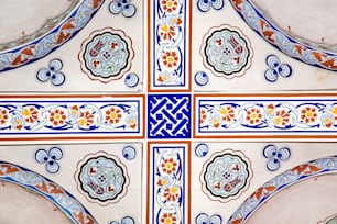 a close up of a tile design on a wall