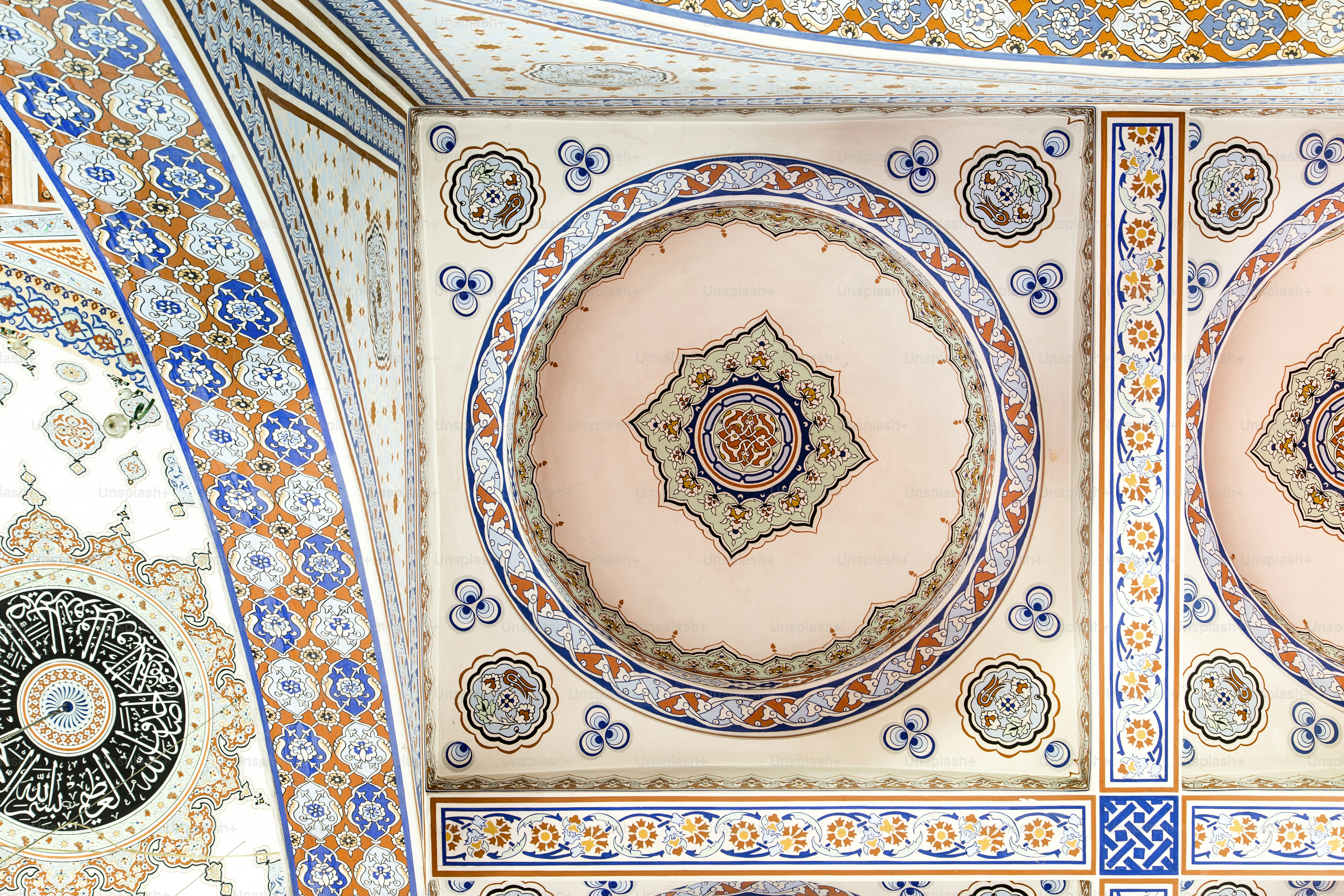 the ceiling of a building with a circular design on it