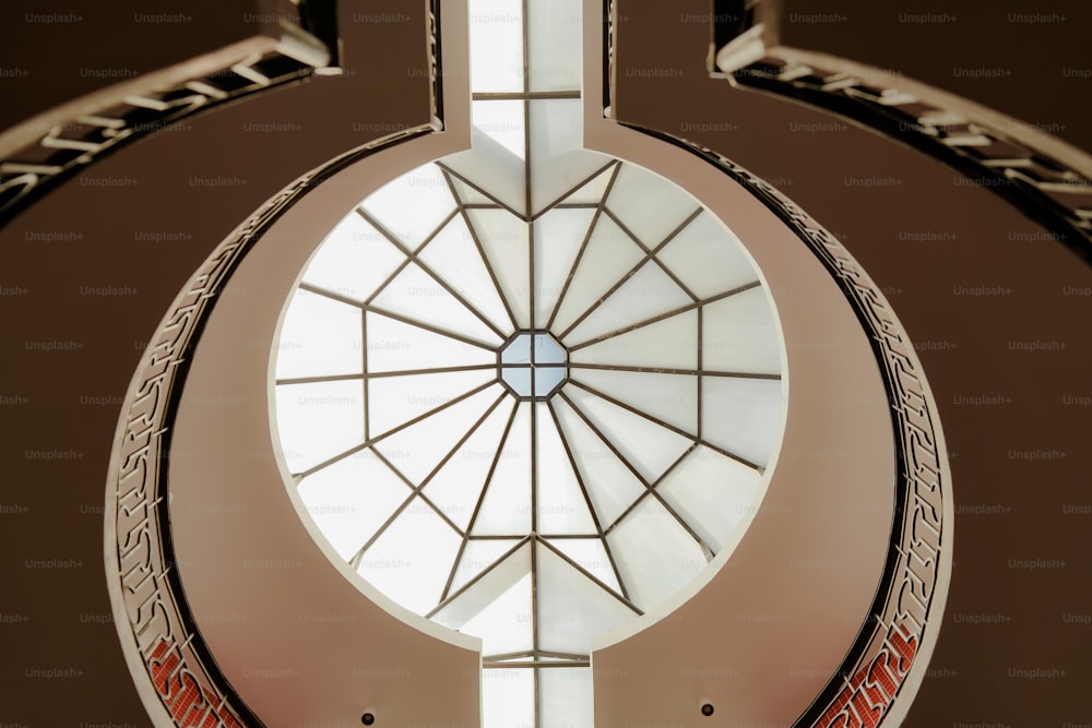 a circular window with a skylight above it