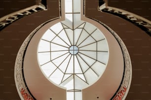 a circular window with a skylight above it