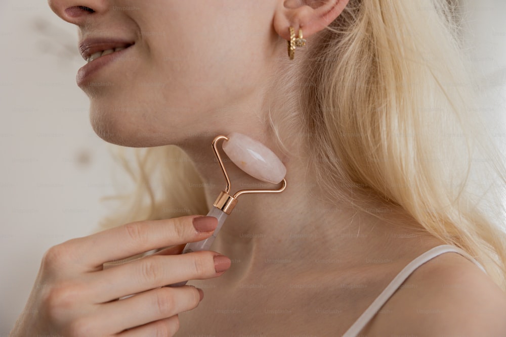 a woman wearing a pair of ear clips