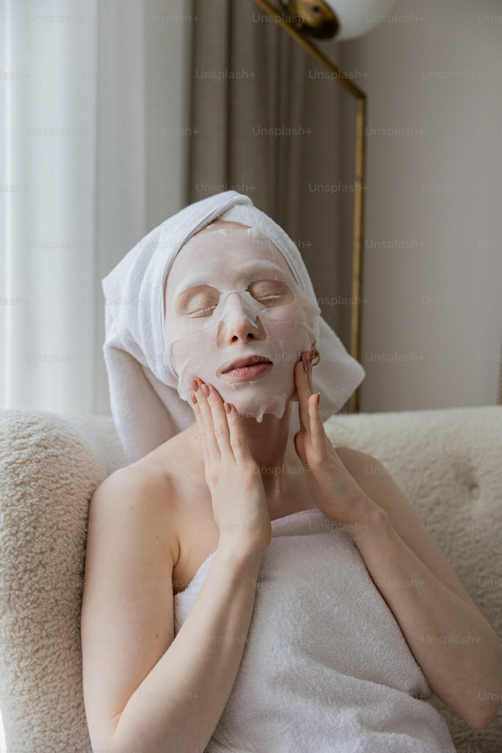 a woman with a white sheet on her face