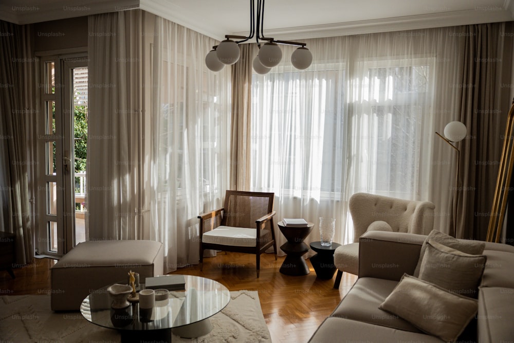 a living room filled with furniture and a large window