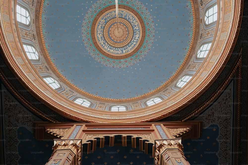 the ceiling of a building with a clock on it