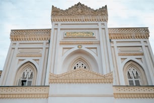 a large white building with a clock on it's side