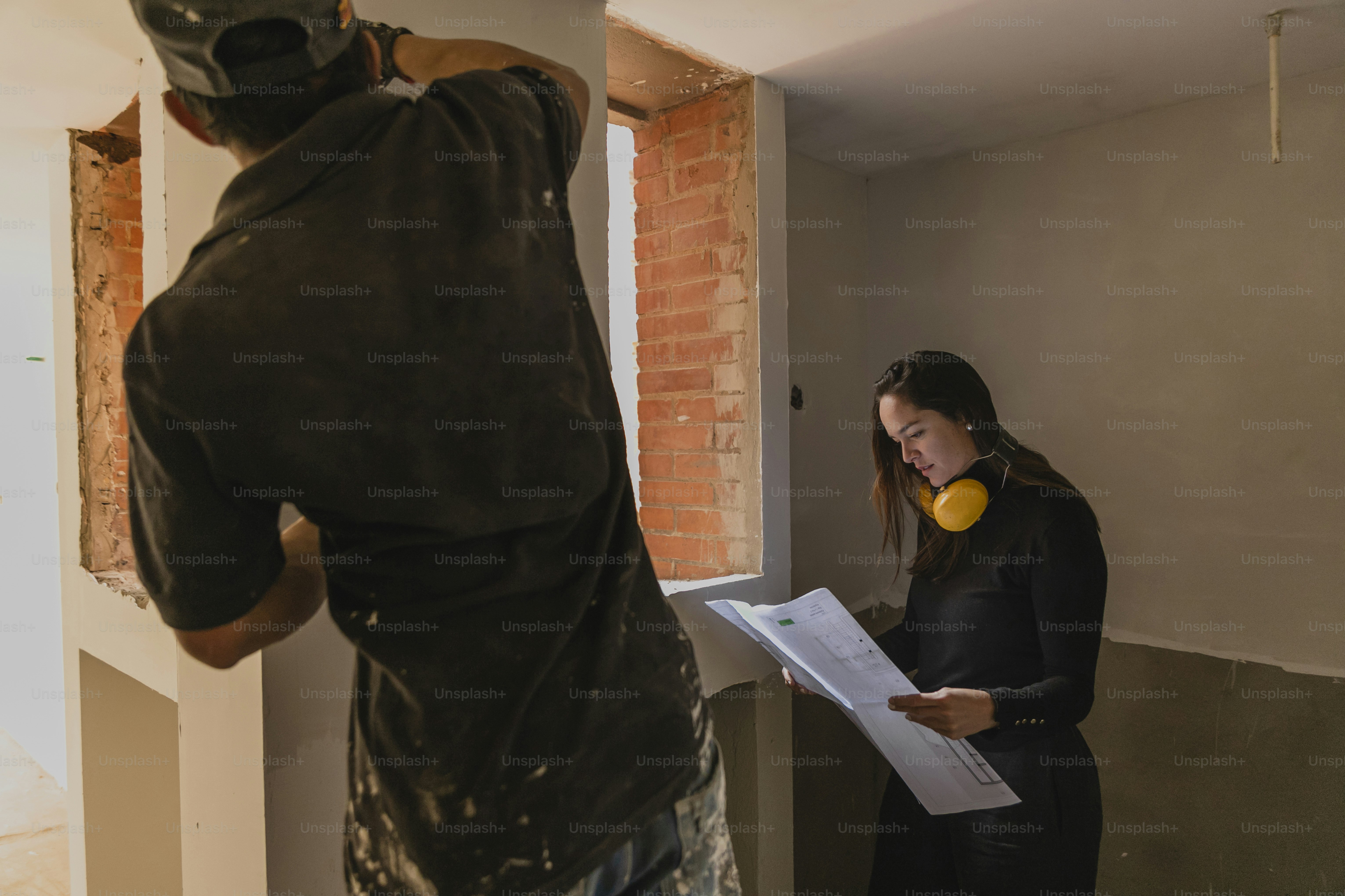 a man and a woman looking at a piece of paper