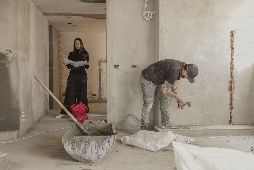 a man and a woman are working on a construction project