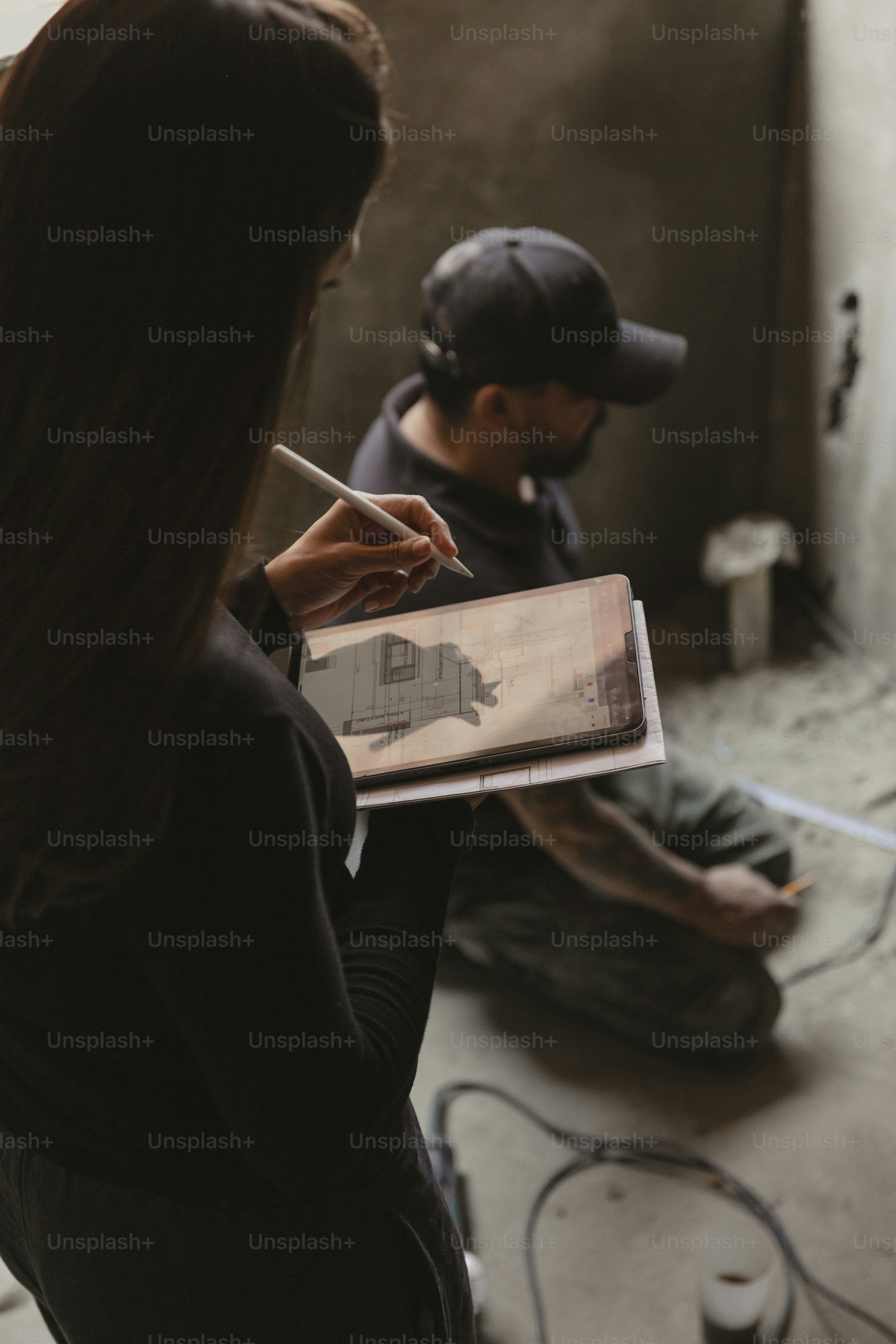 a man and a woman sitting on the floor