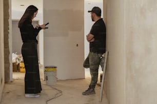 a man and a woman standing in a room