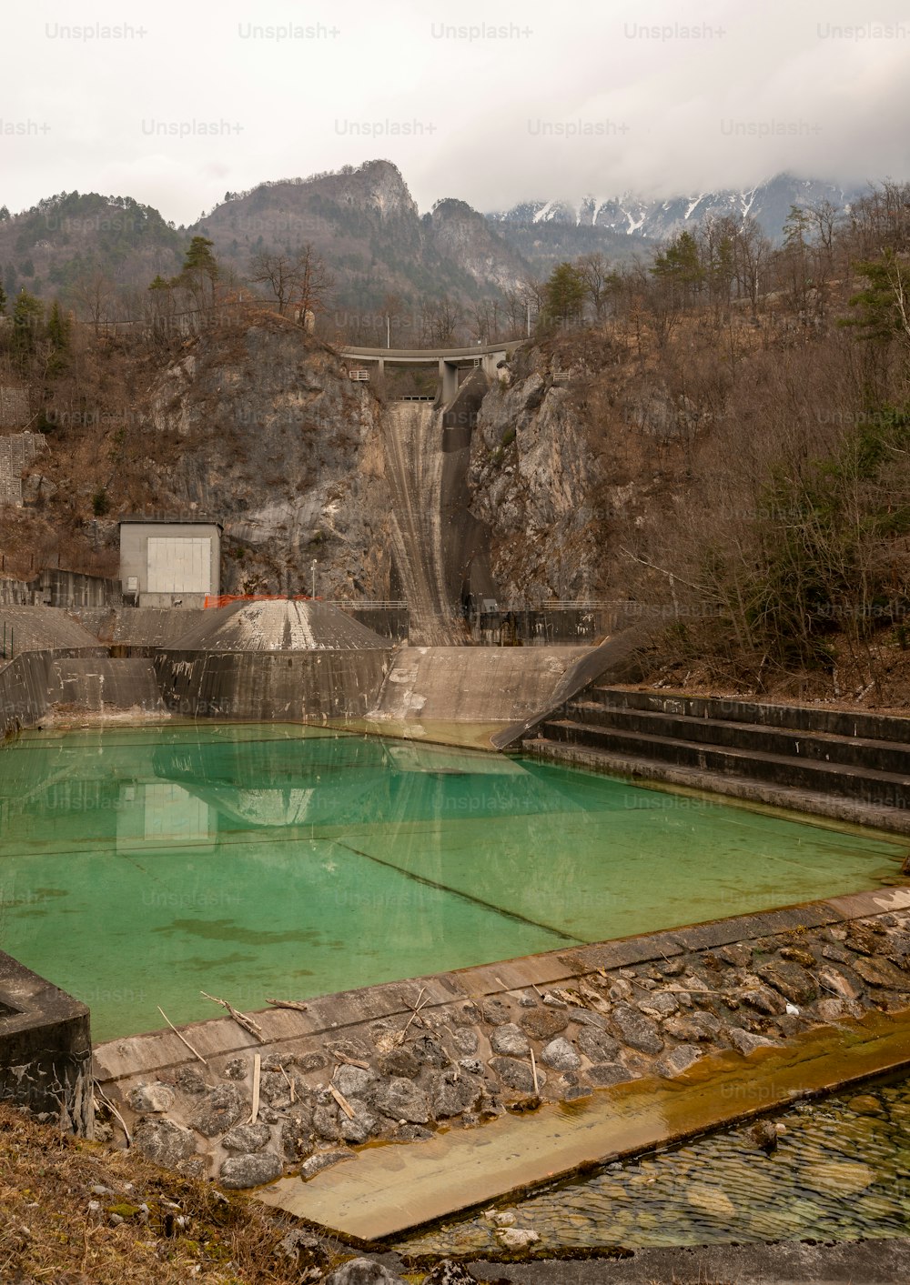 a large pool of water surrounded by mountains