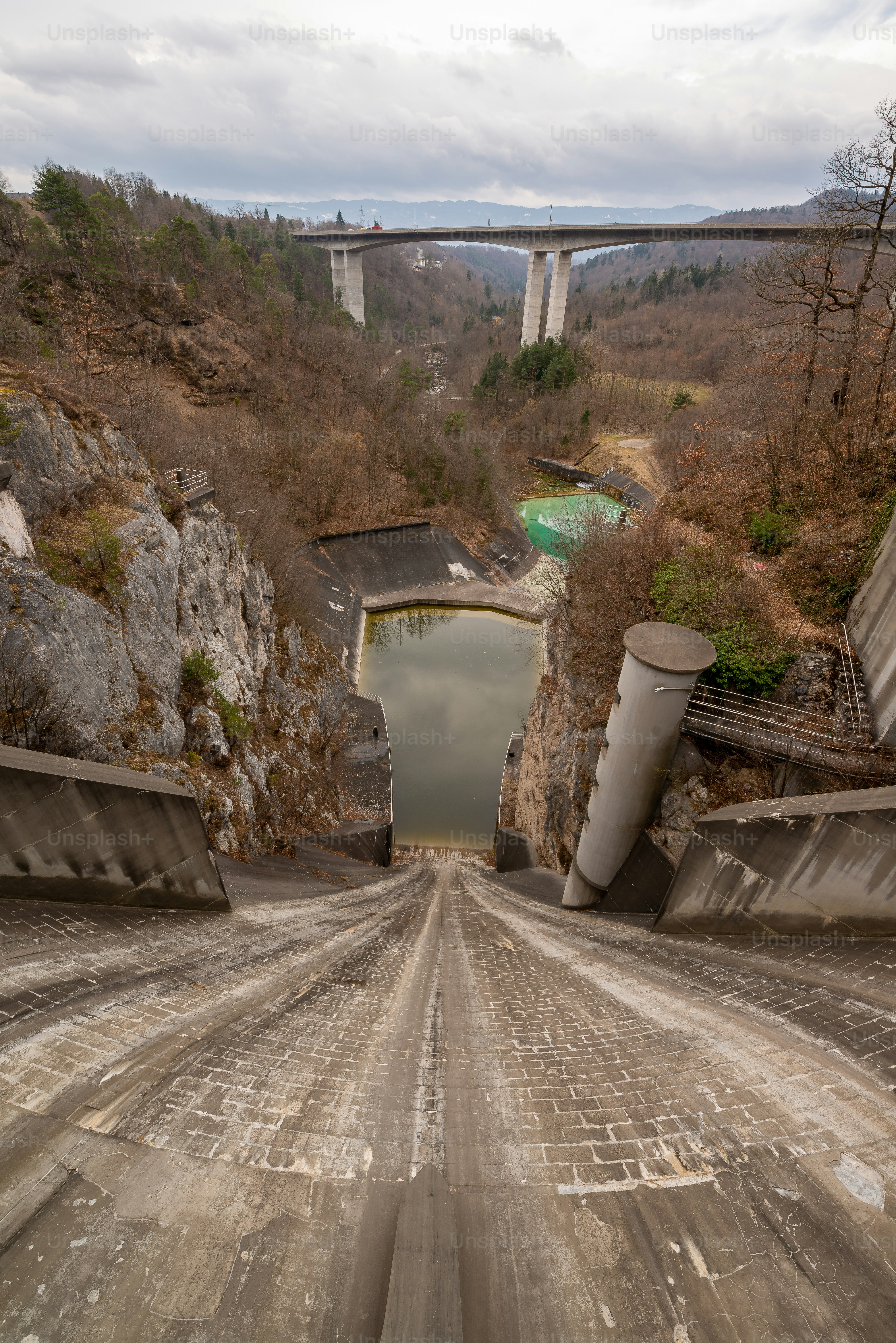 A hydropower plant on the river Sava in Europe in the early spring when there is insufficient water. Soon the snow in the mountains will melt, giving the power plant enough energy to operate.