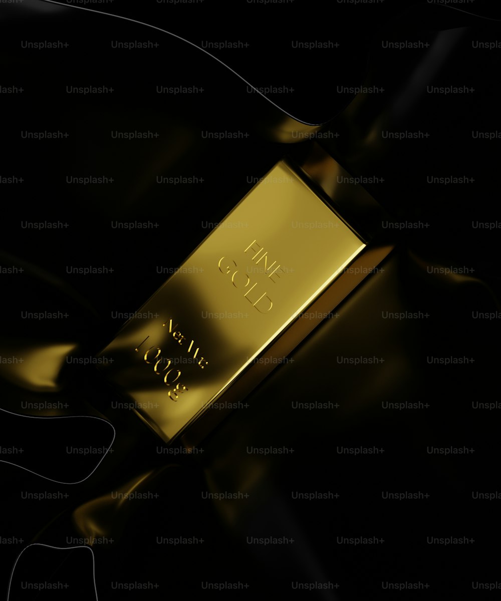 a gold bar sitting on top of a black surface
