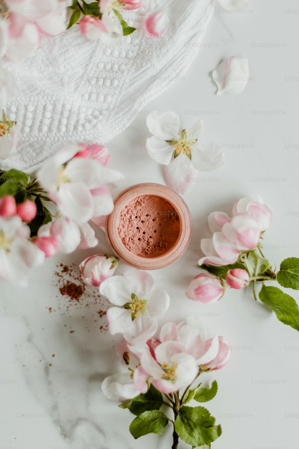 a cup of hot chocolate surrounded by flowers