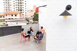 a group of people sitting on top of a roof