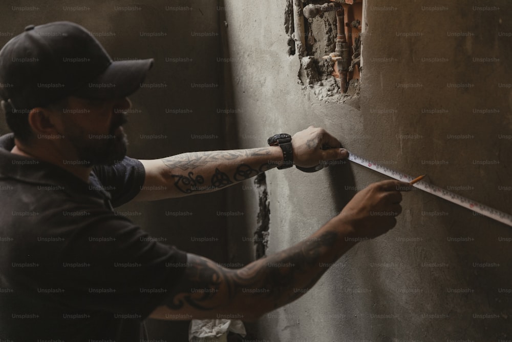 a man with a tattoo on his arm holding a knife