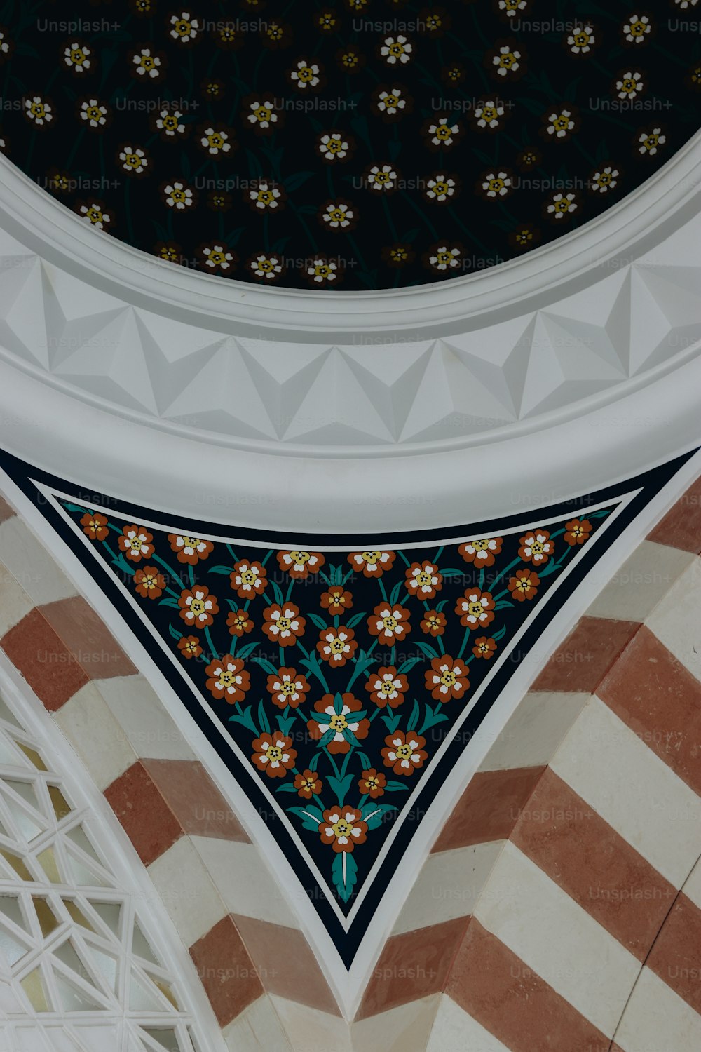 a close up view of a decorative ceiling in a building