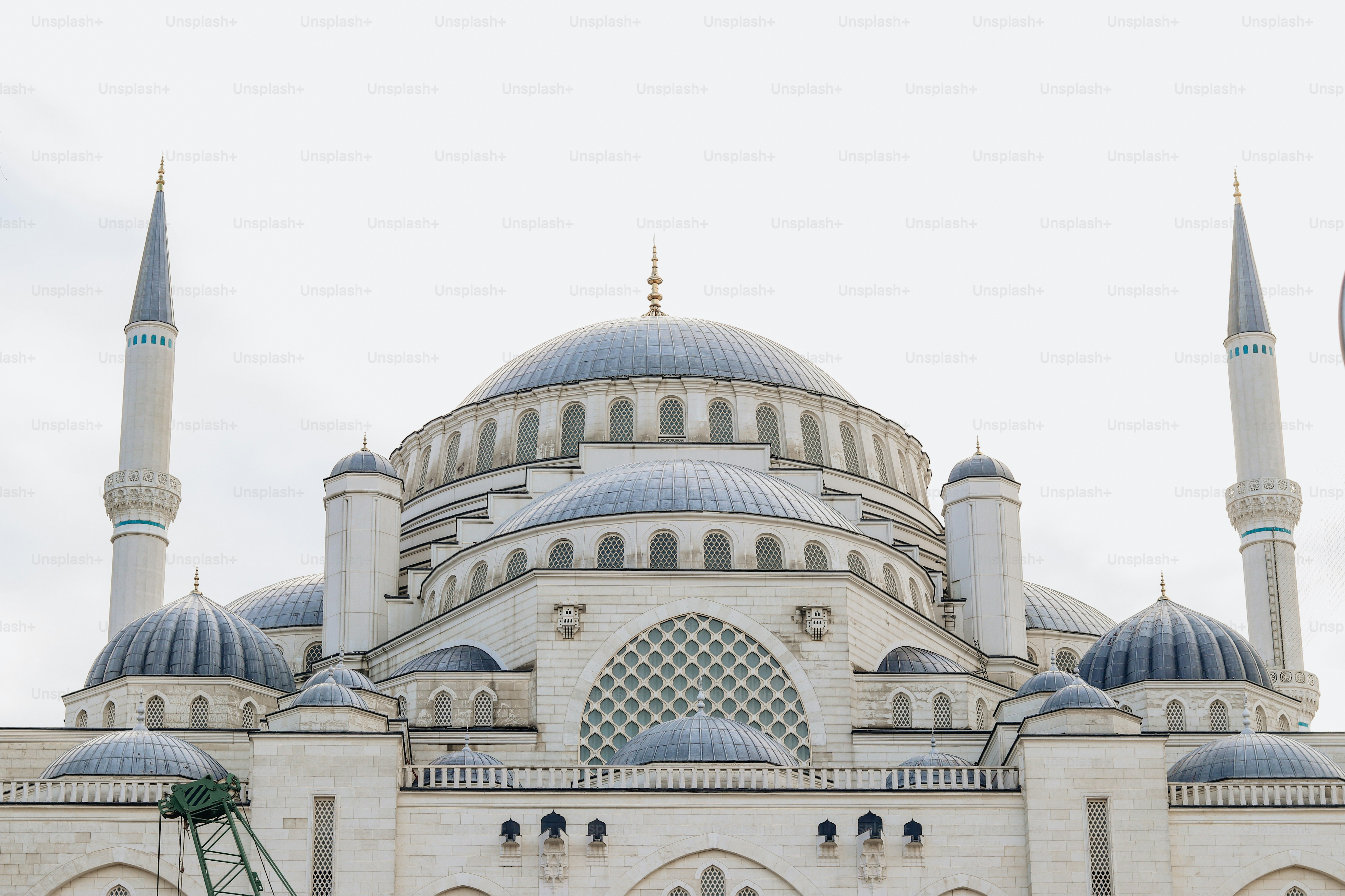 a large white building with two blue domes