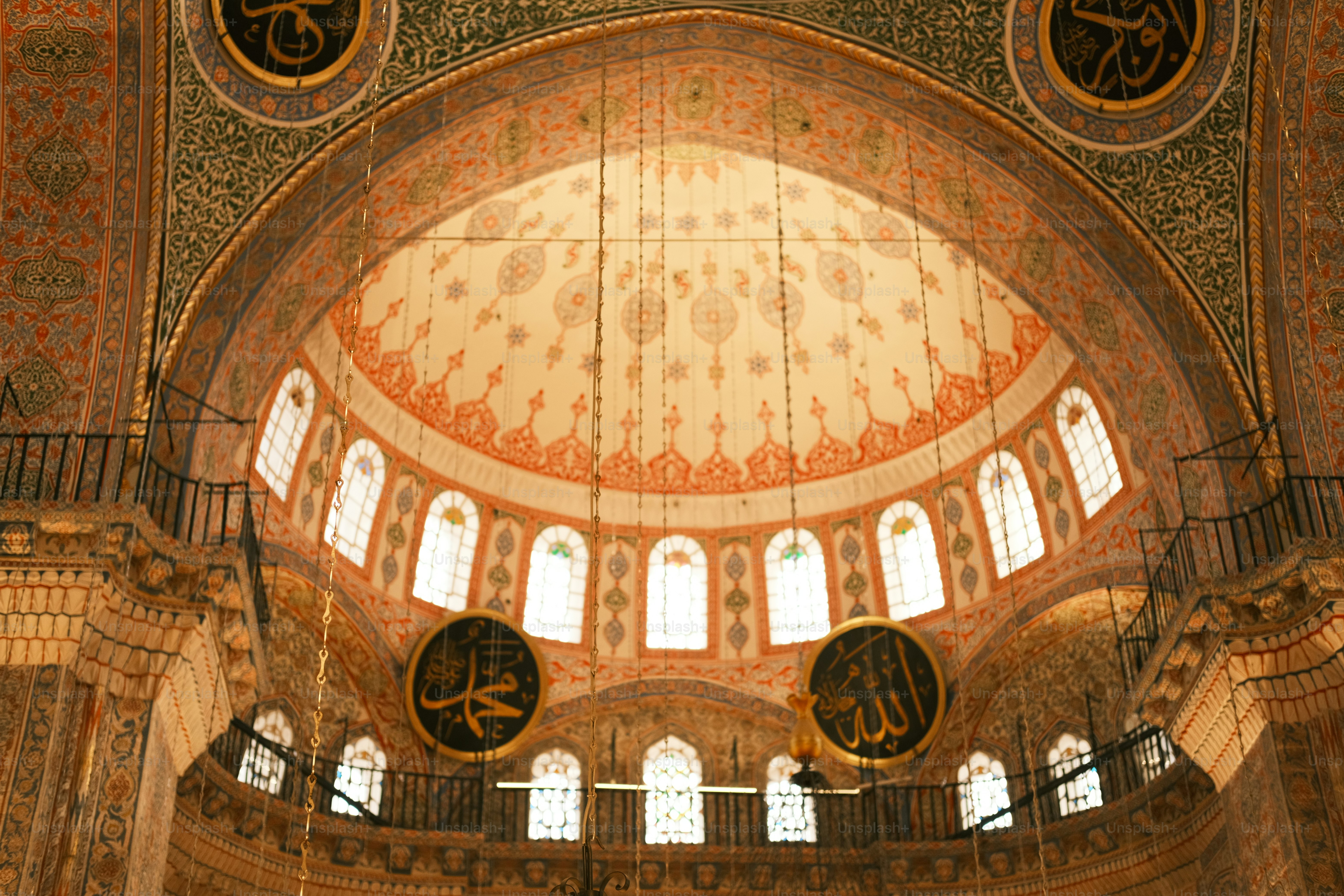 the inside of a large building with a clock on the wall
