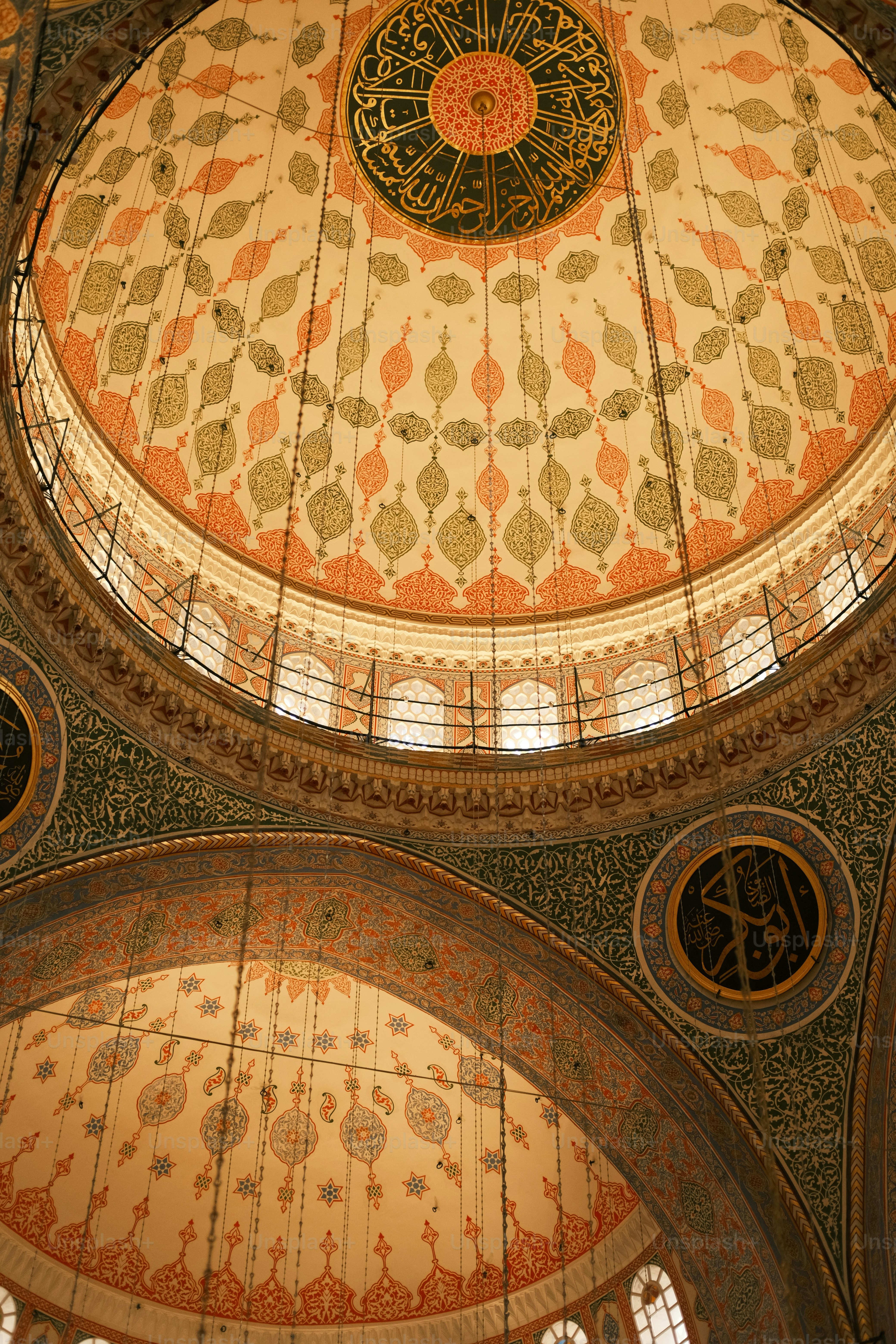 the ceiling of a large building with intricate designs