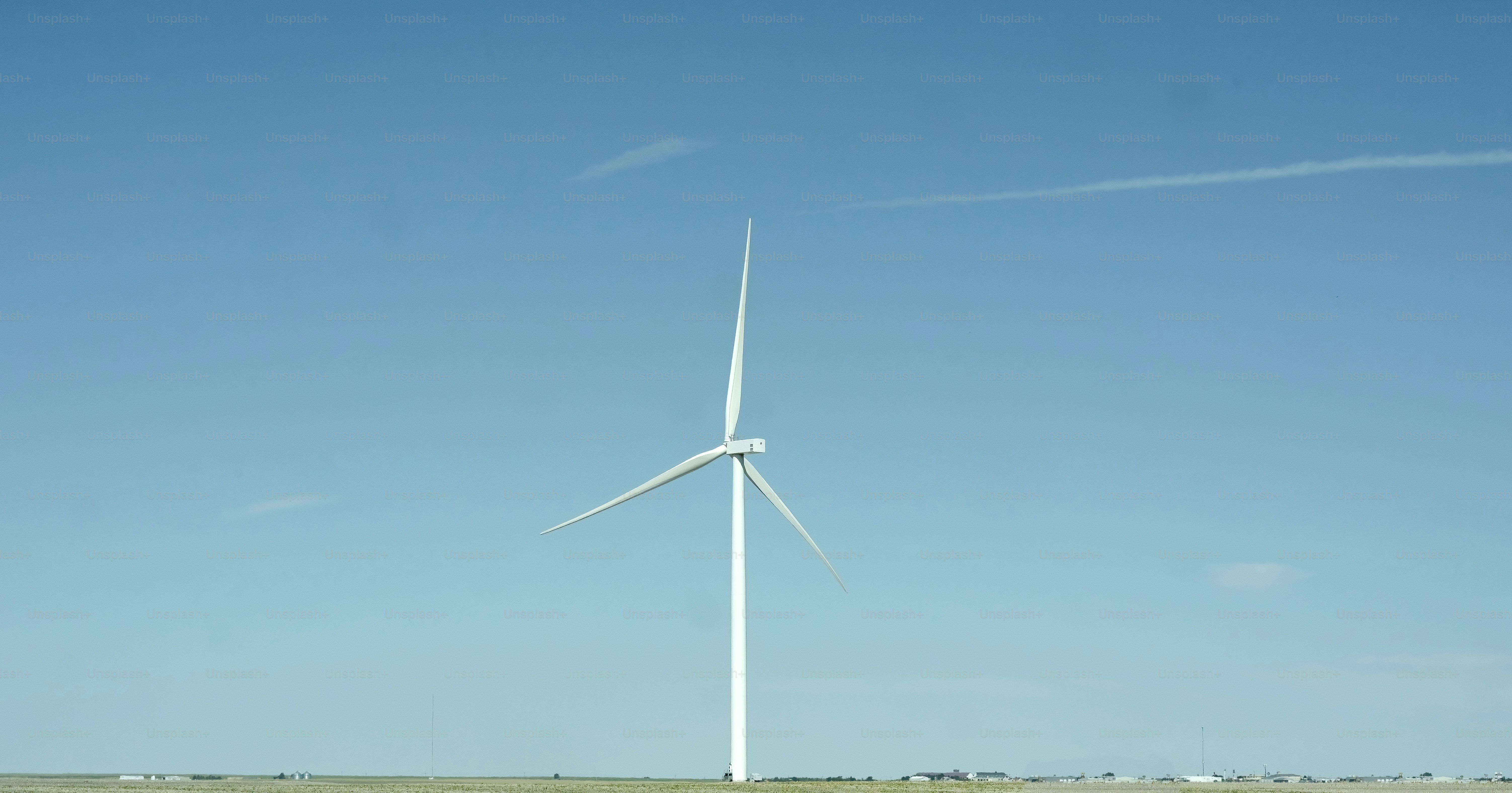 a wind turbine in the middle of a field