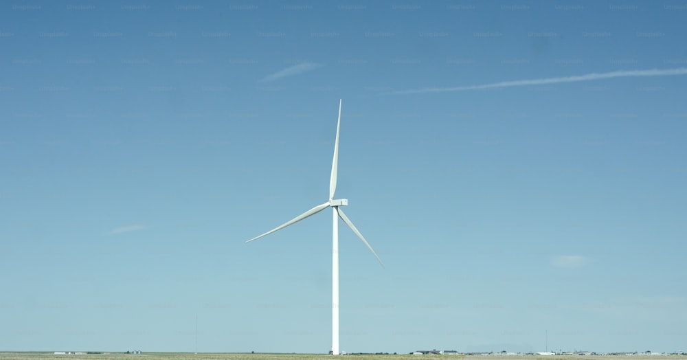 a wind turbine in the middle of a field