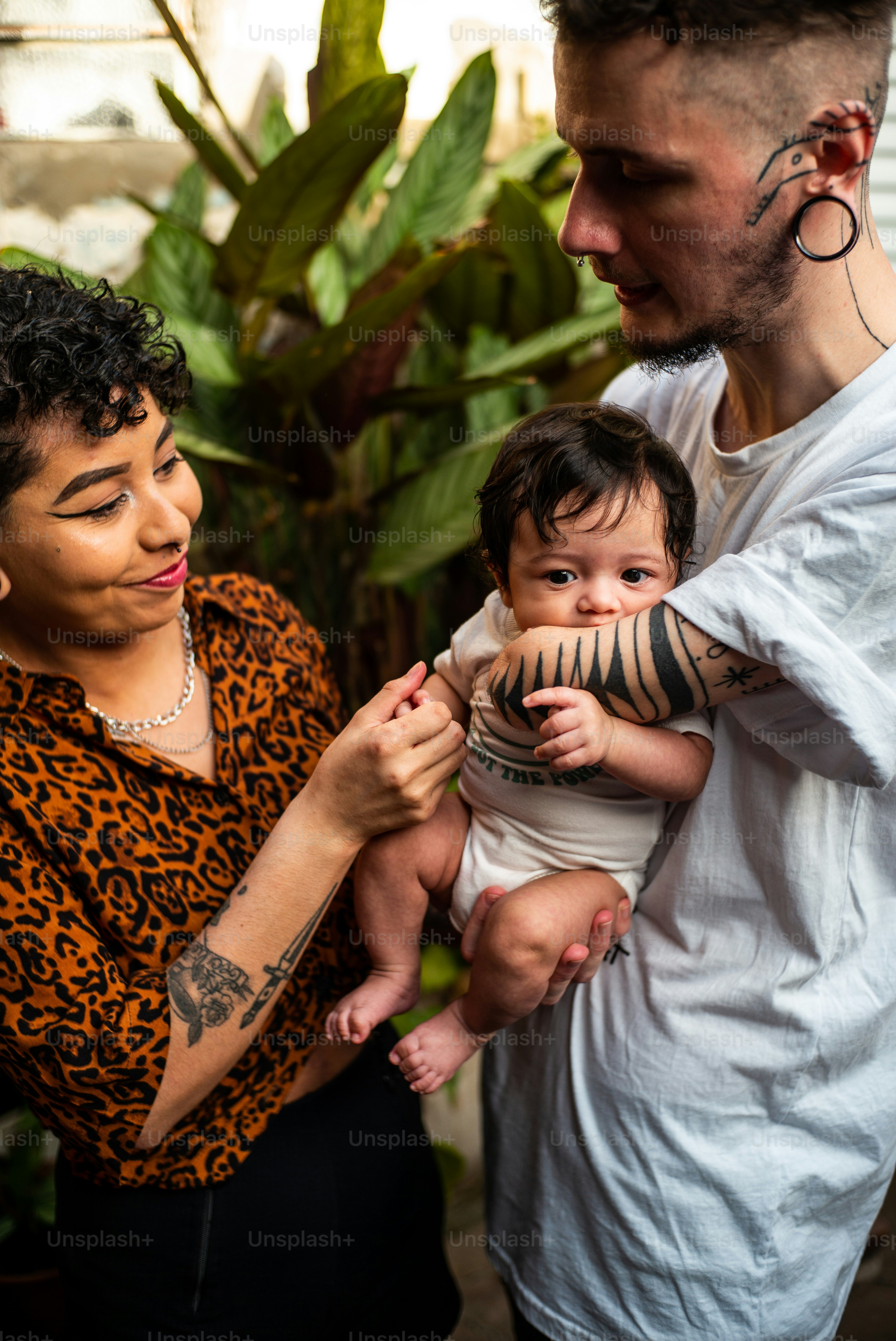 a man holding a baby in his arms