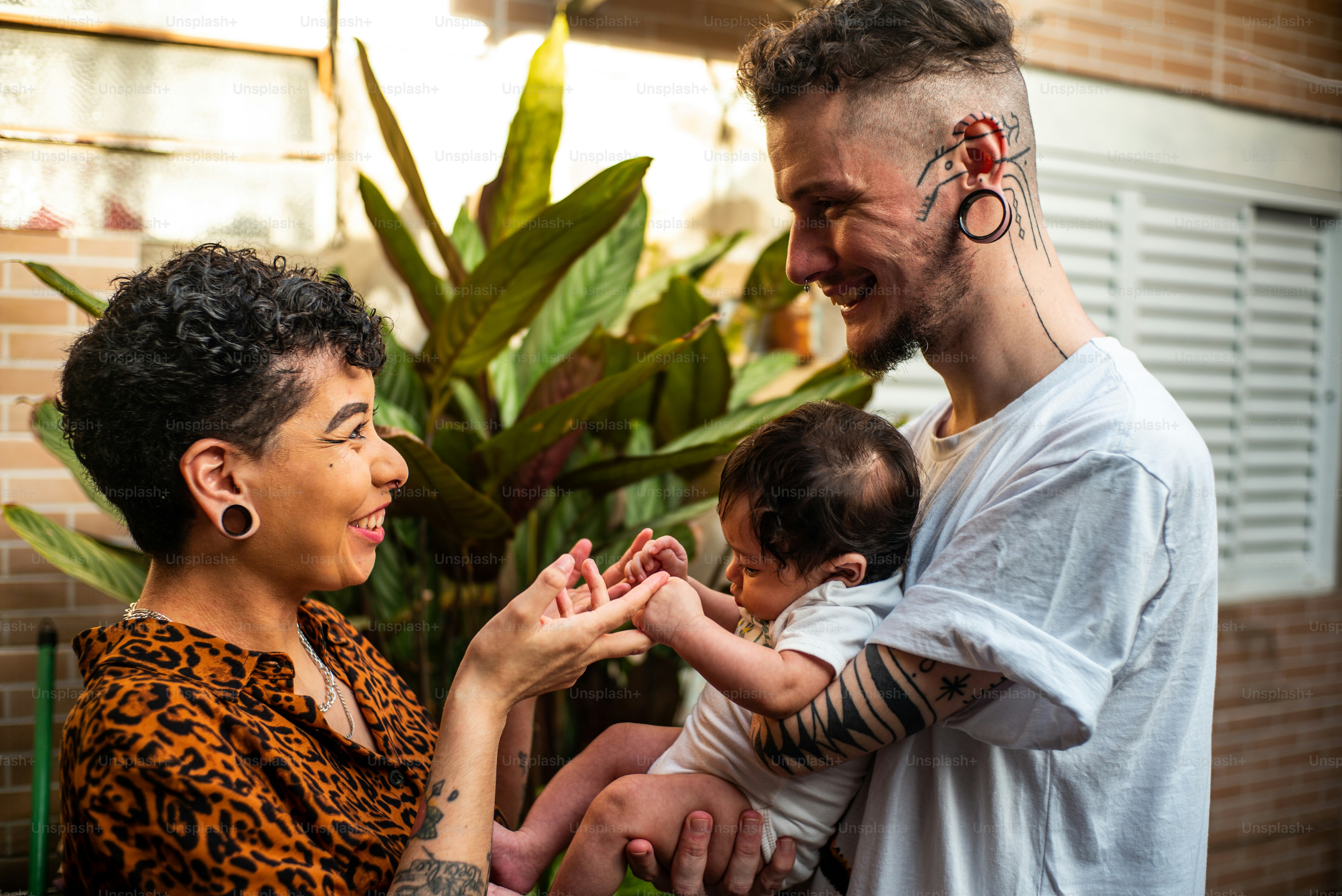 a man holding a baby in his arms