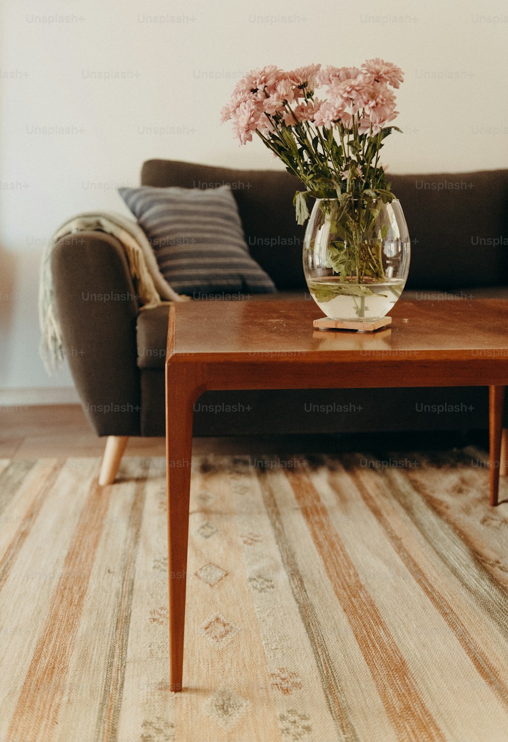 a table with a vase of flowers on it