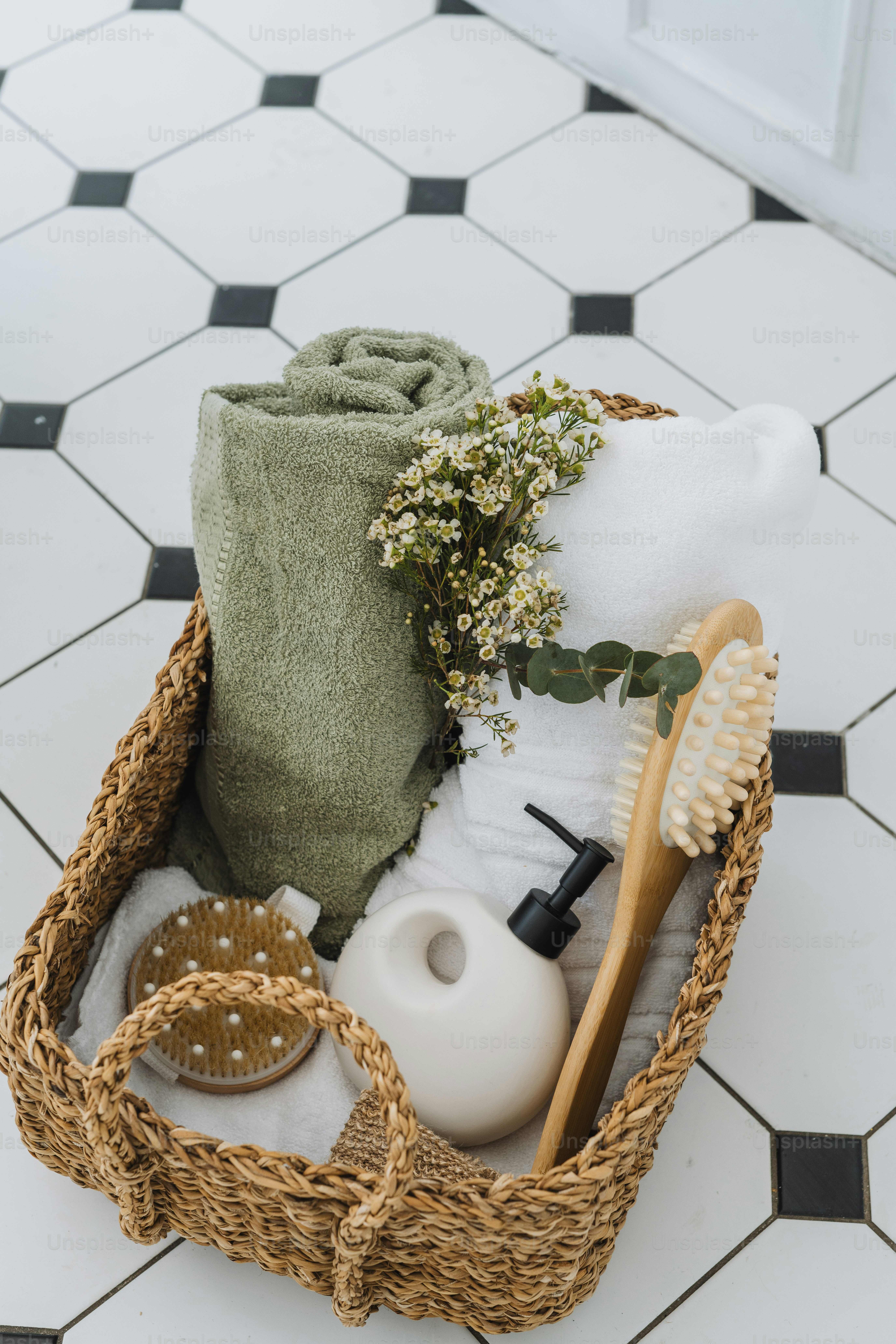a basket filled with a lot of items on top of a tiled floor
