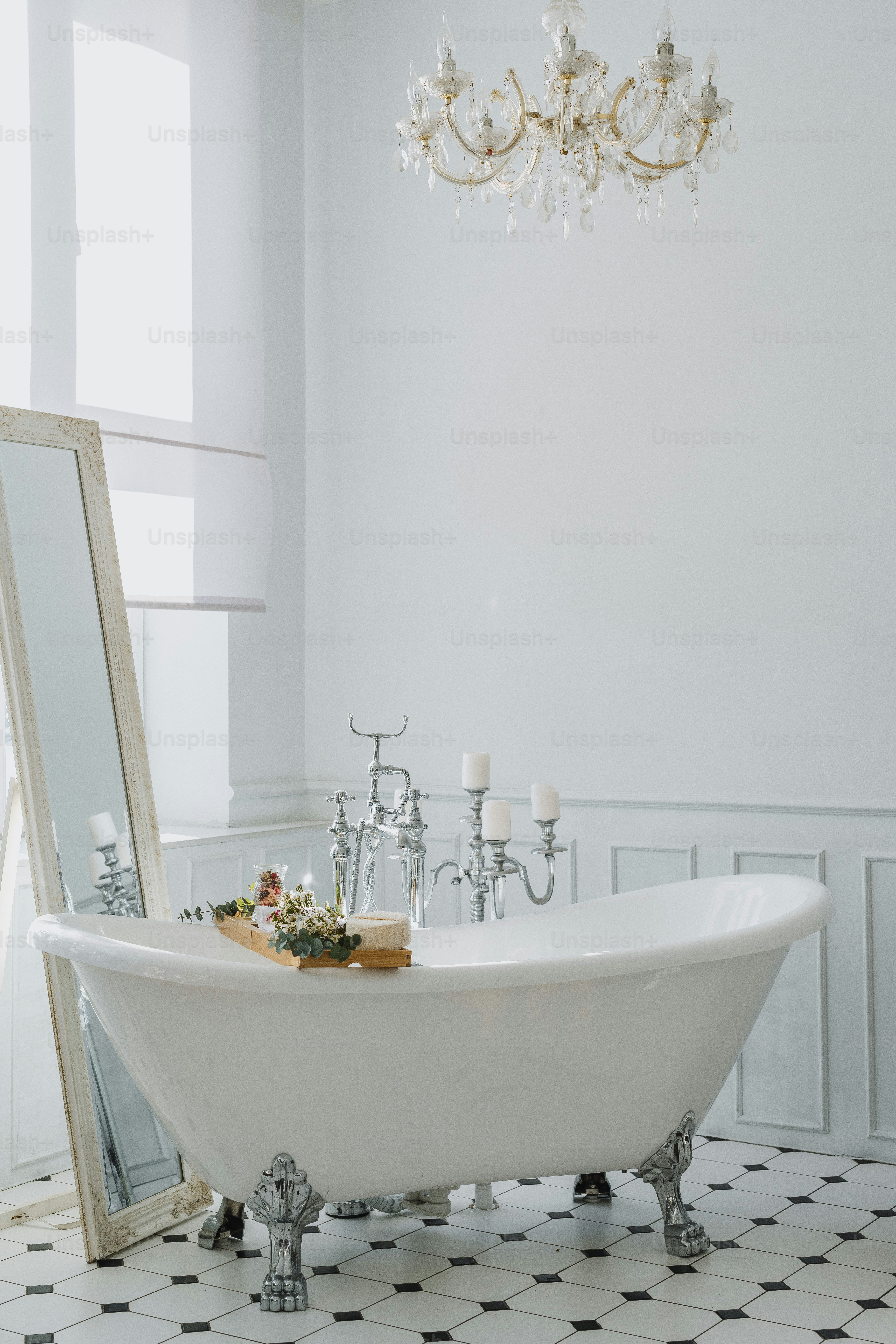 a white bath tub sitting in a bathroom next to a mirror