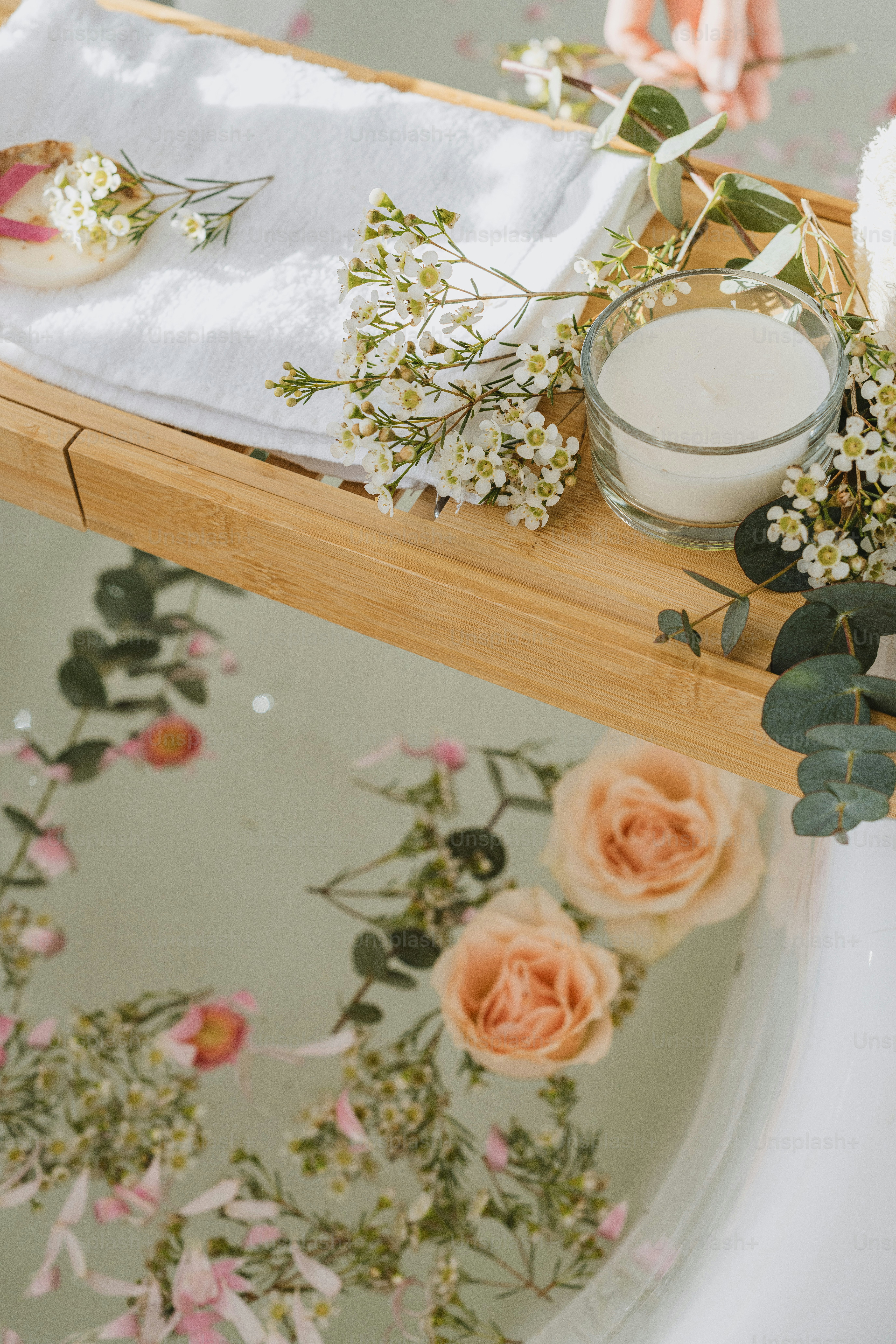 a wooden table topped with a vase filled with flowers