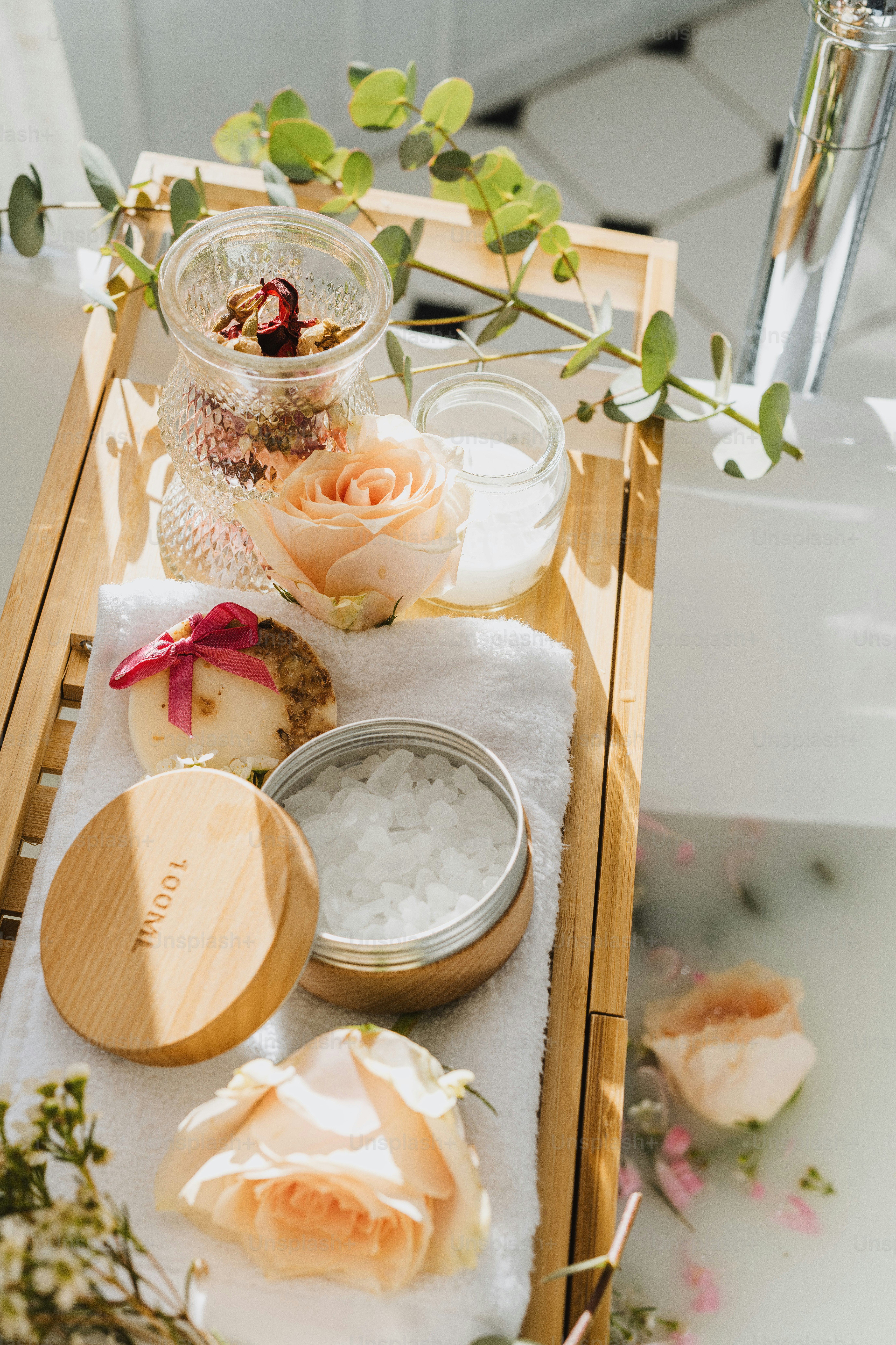 a wooden tray topped with lots of flowers