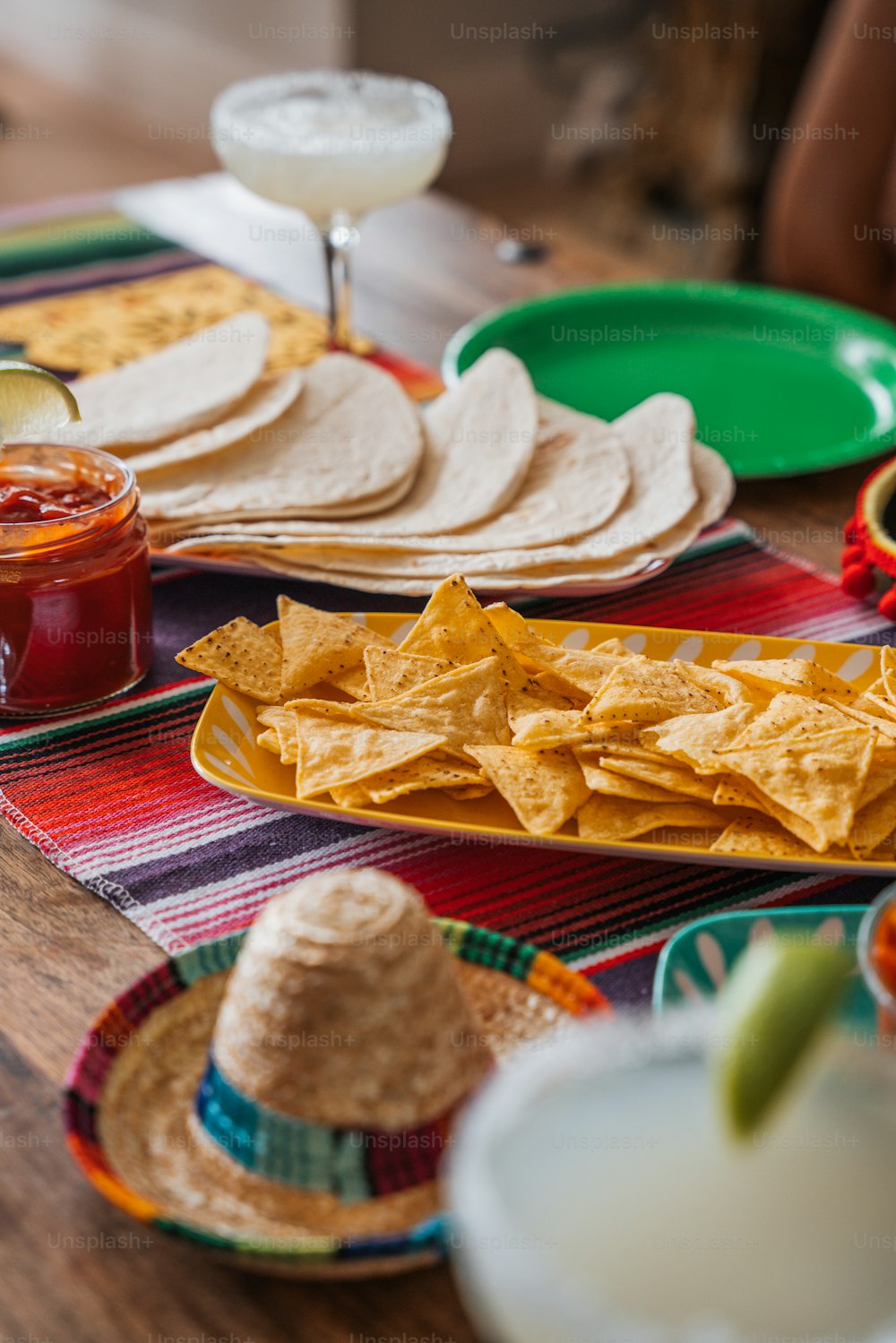 a table topped with plates of food and drinks