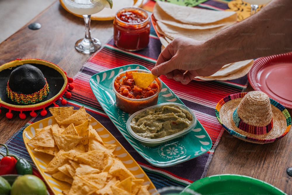 a table topped with plates and bowls filled with food