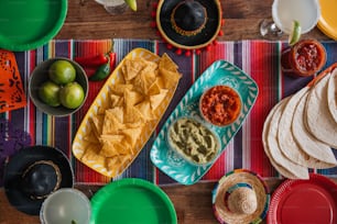 a table topped with plates and bowls filled with food