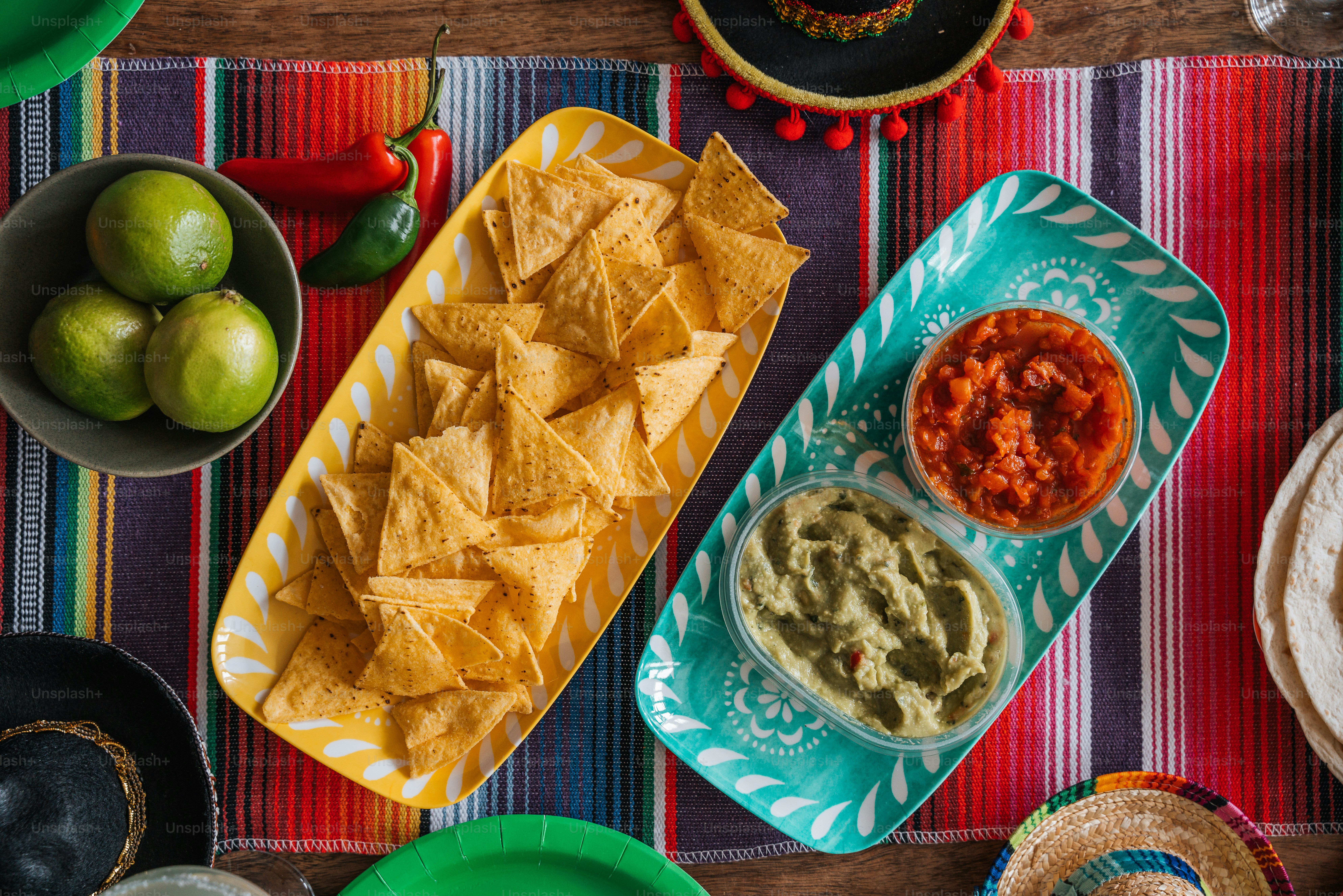 a table topped with plates and bowls filled with food