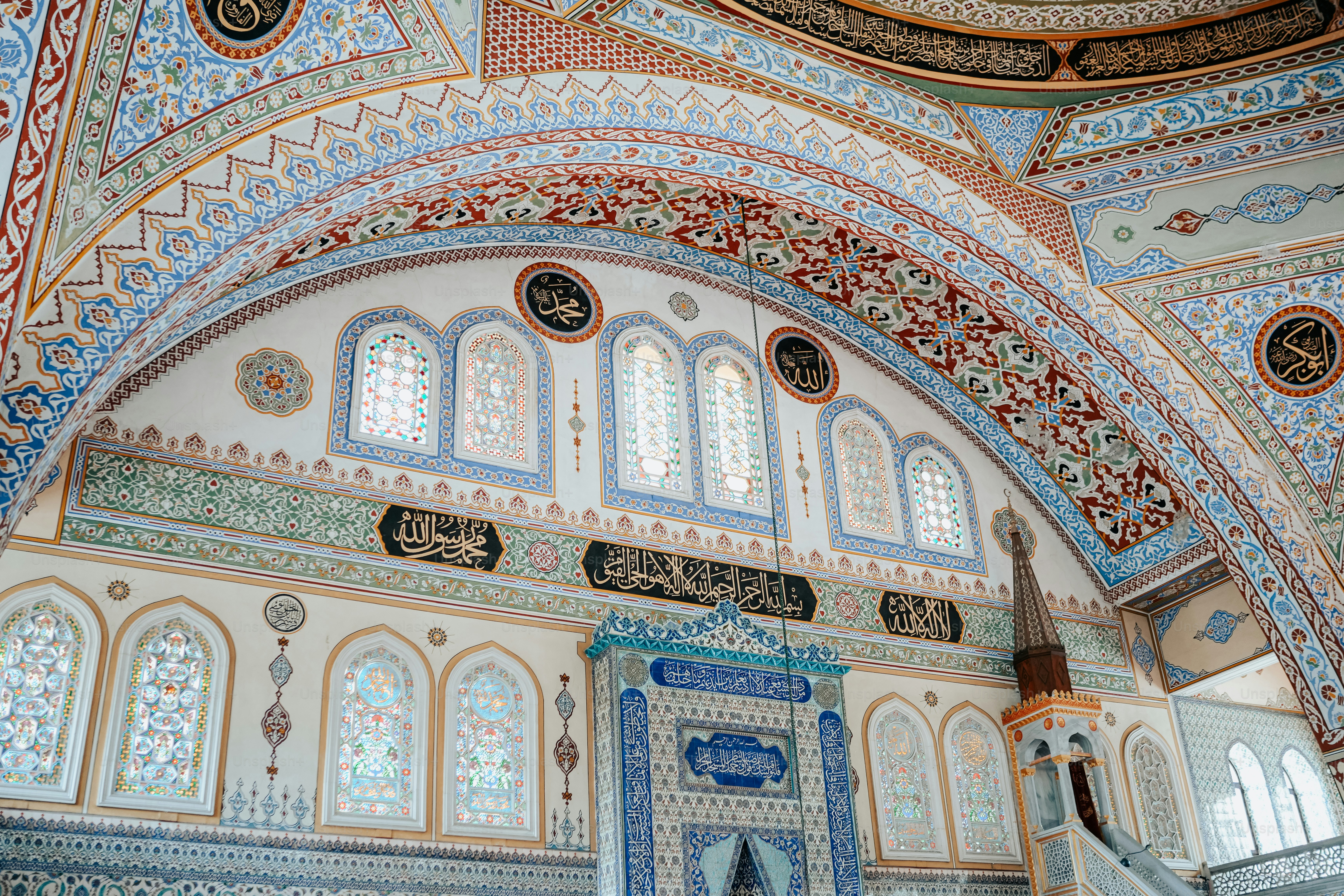 an ornate building with a blue and red ceiling