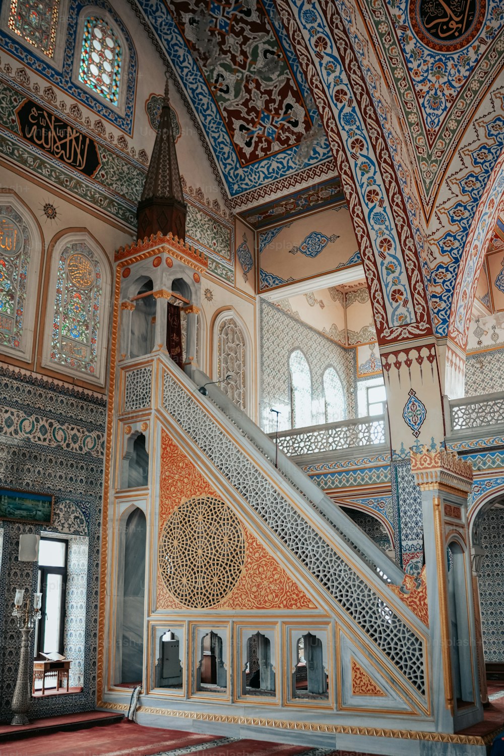 a staircase inside of a building with intricate designs