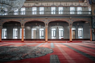 a large room with a chandelier hanging from the ceiling