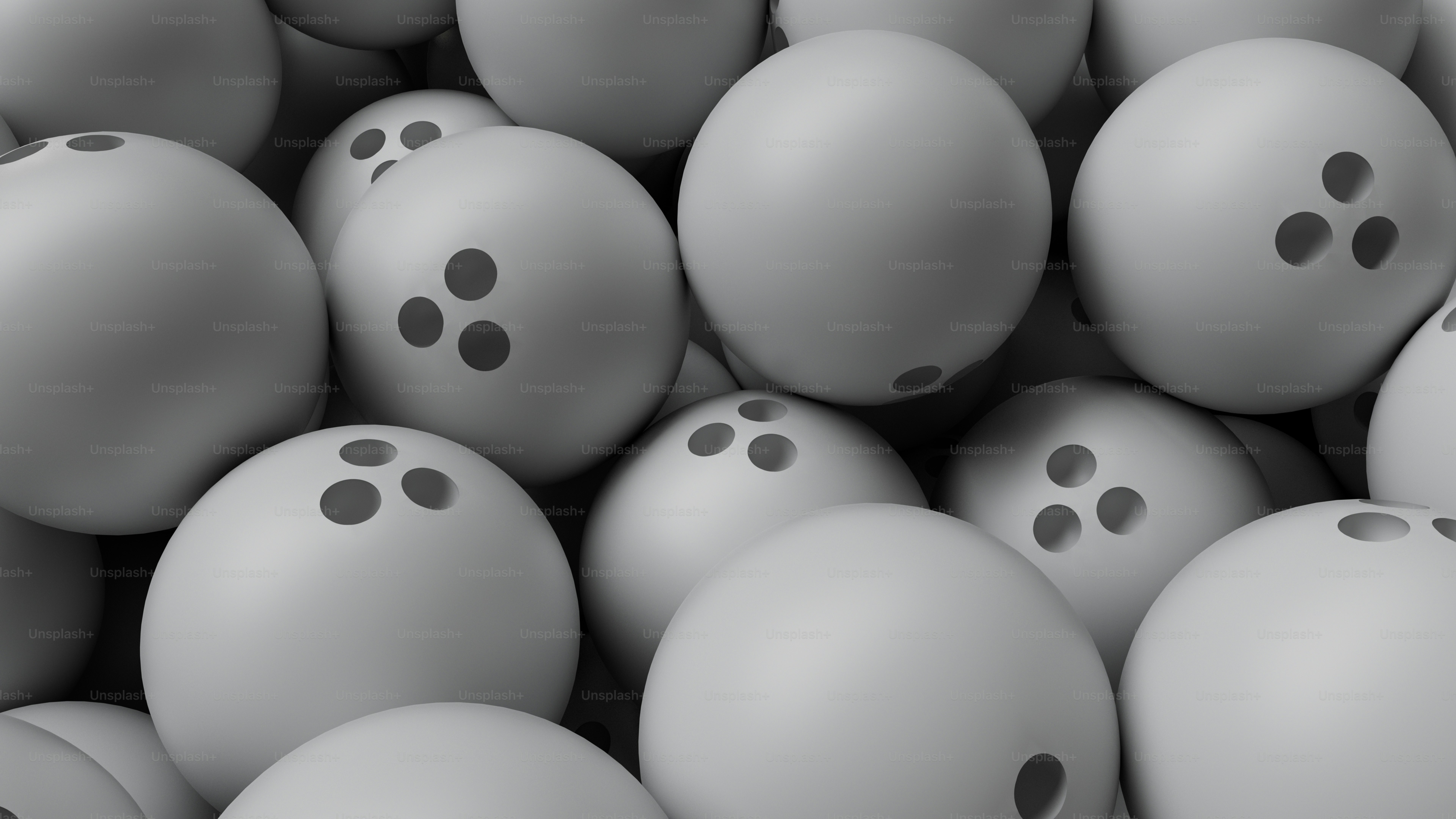 A bunch of gray balls with holes in them photo Bowling Image on Unsplash
