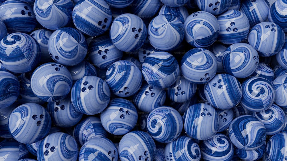 a pile of blue and white marble balls